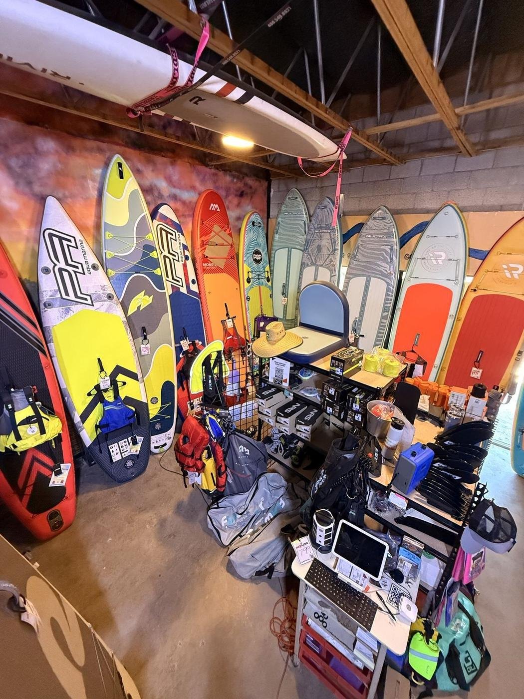 Inside the Redline shop with boards, life jackets and accessories